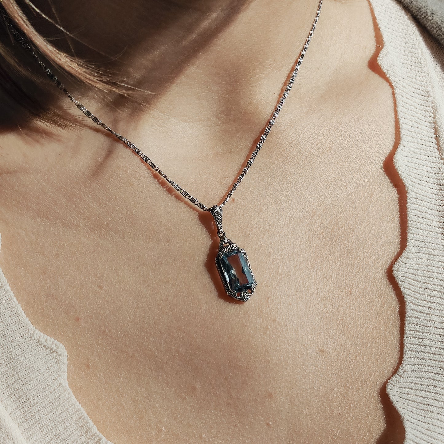Art Deco Pendant with Blue Spinel around neck
