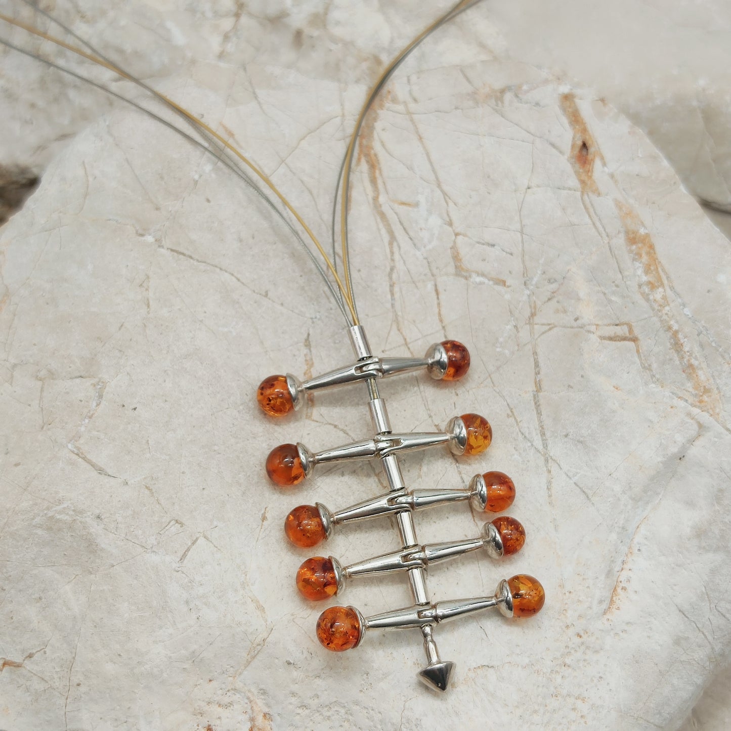 Modernist kinetic amber necklace 1970s silver