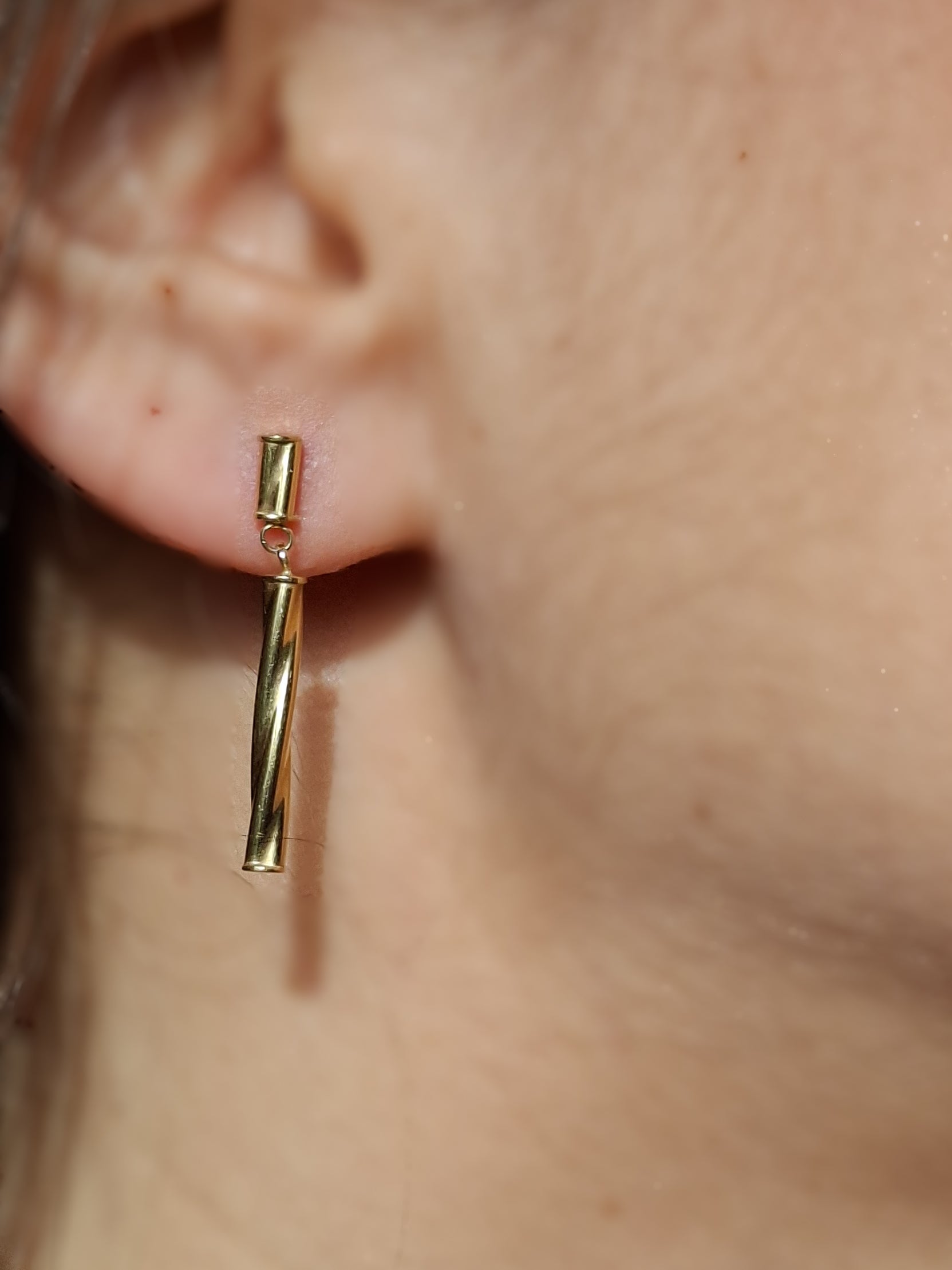 Vintage 9ct gold twisted drop earrings worn in ear