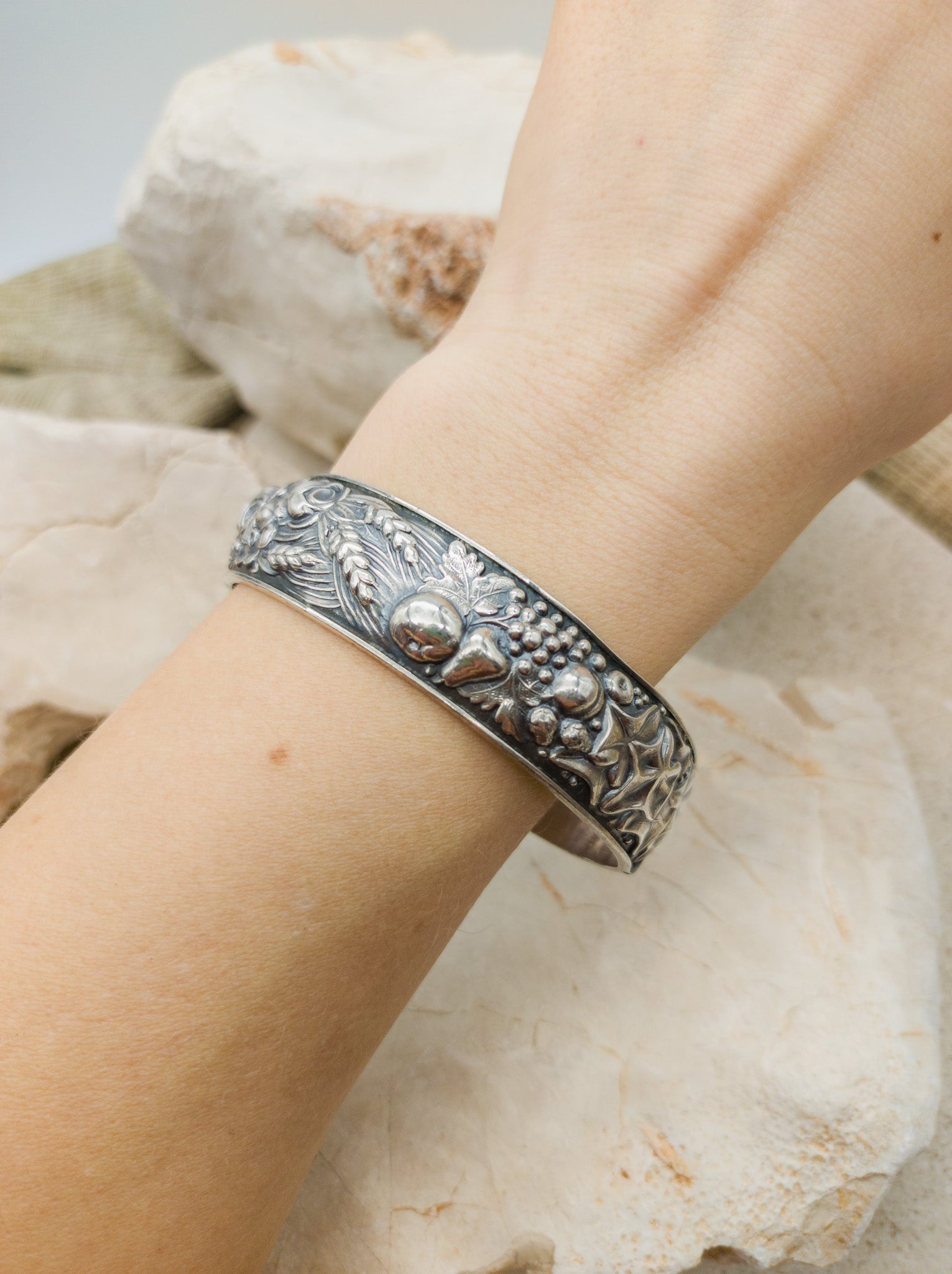 Vintage portugese silver repoussé bracelet with harvest theme on arm