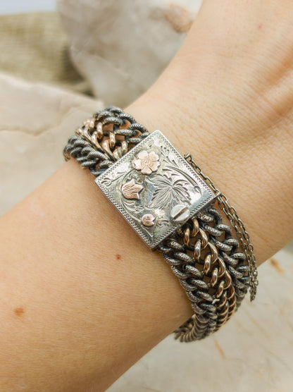 Victorian Silver repoussé chain bracelet with box clasp and rose gold plated details. on arm