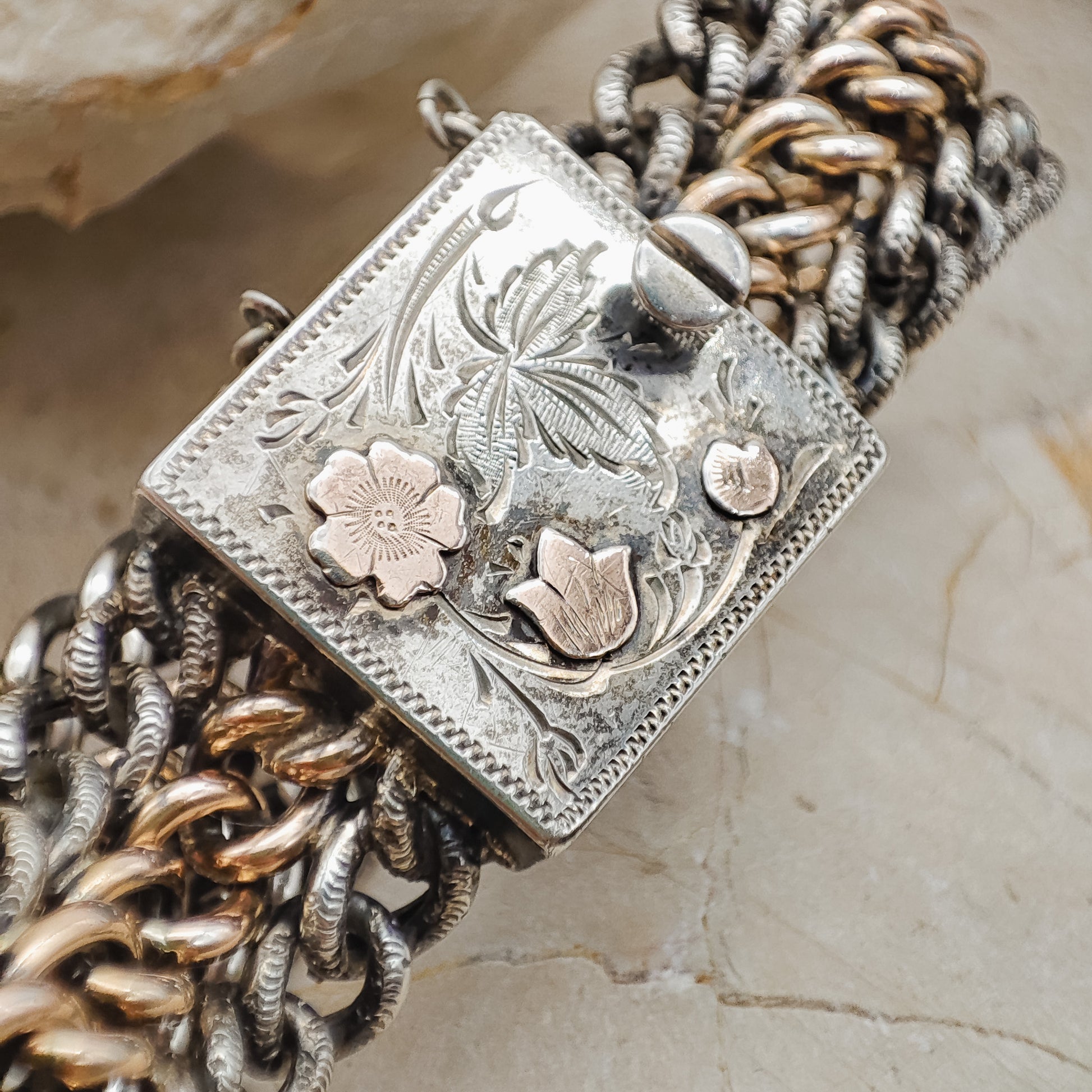 Victorian Silver repoussé chain bracelet with box clasp and rose gold plated details.