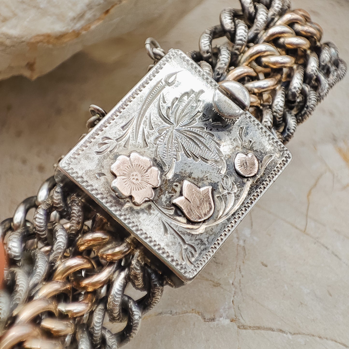 Victorian Silver repoussé chain bracelet with box clasp and rose gold plated details, detailed view of the box clasp