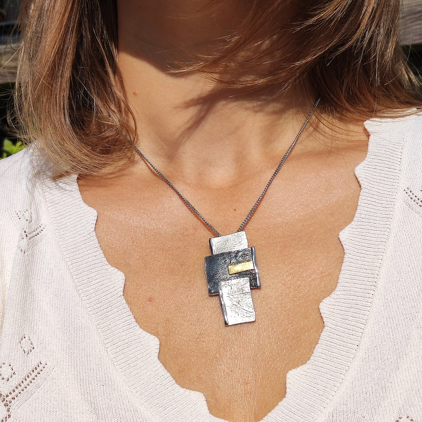 Handmade pendant by Audar in silver with 24K gold details