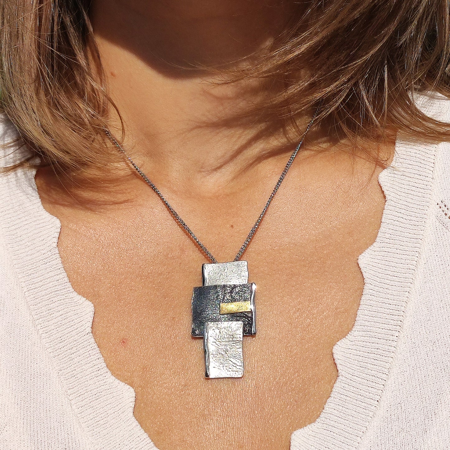 Handmade pendant by Audar in silver with 24K gold details