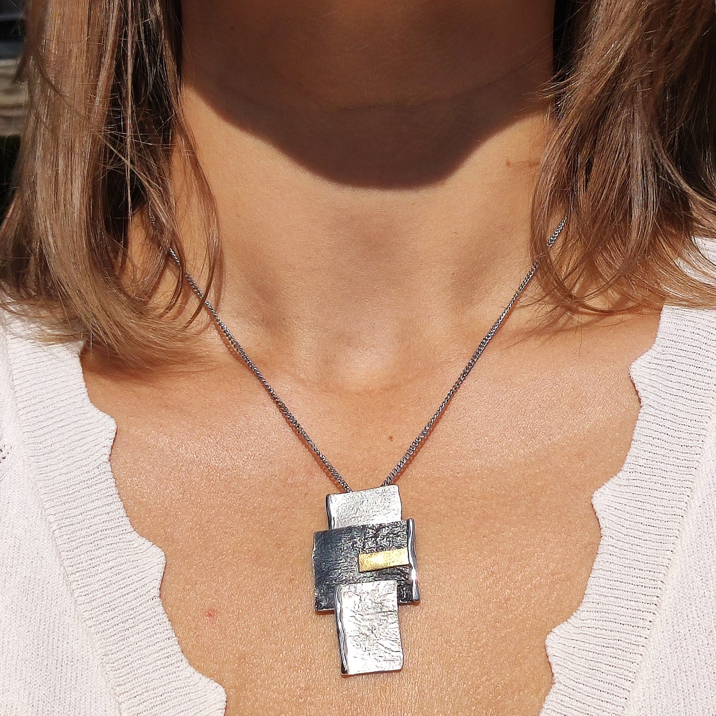 Handmade pendant by Audar in silver with 24K gold details