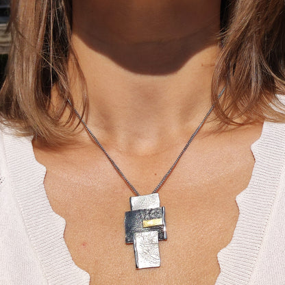 Handmade pendant by Audar in silver with 24K gold details