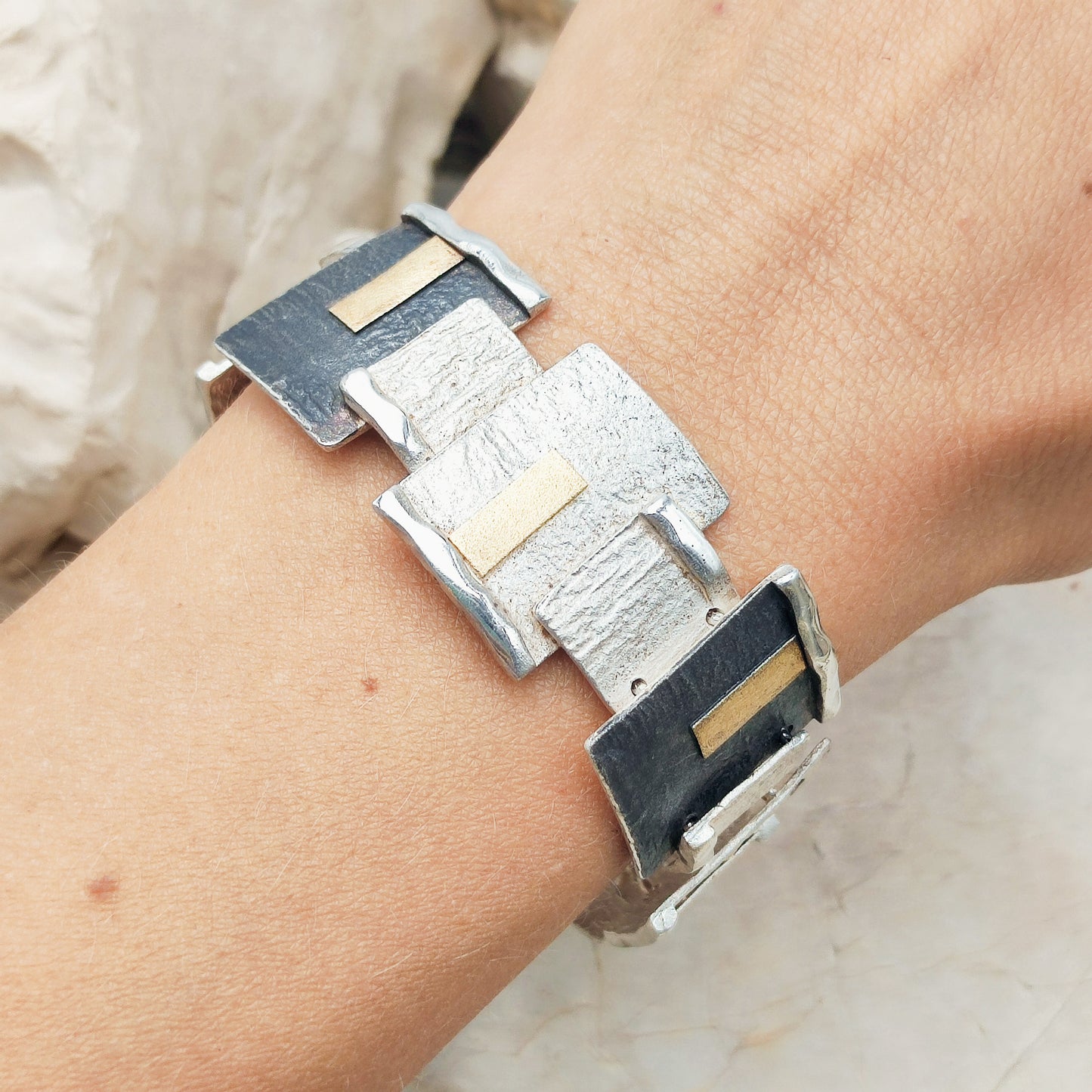 Handmade bracelet by Audar in silver with 24K gold details