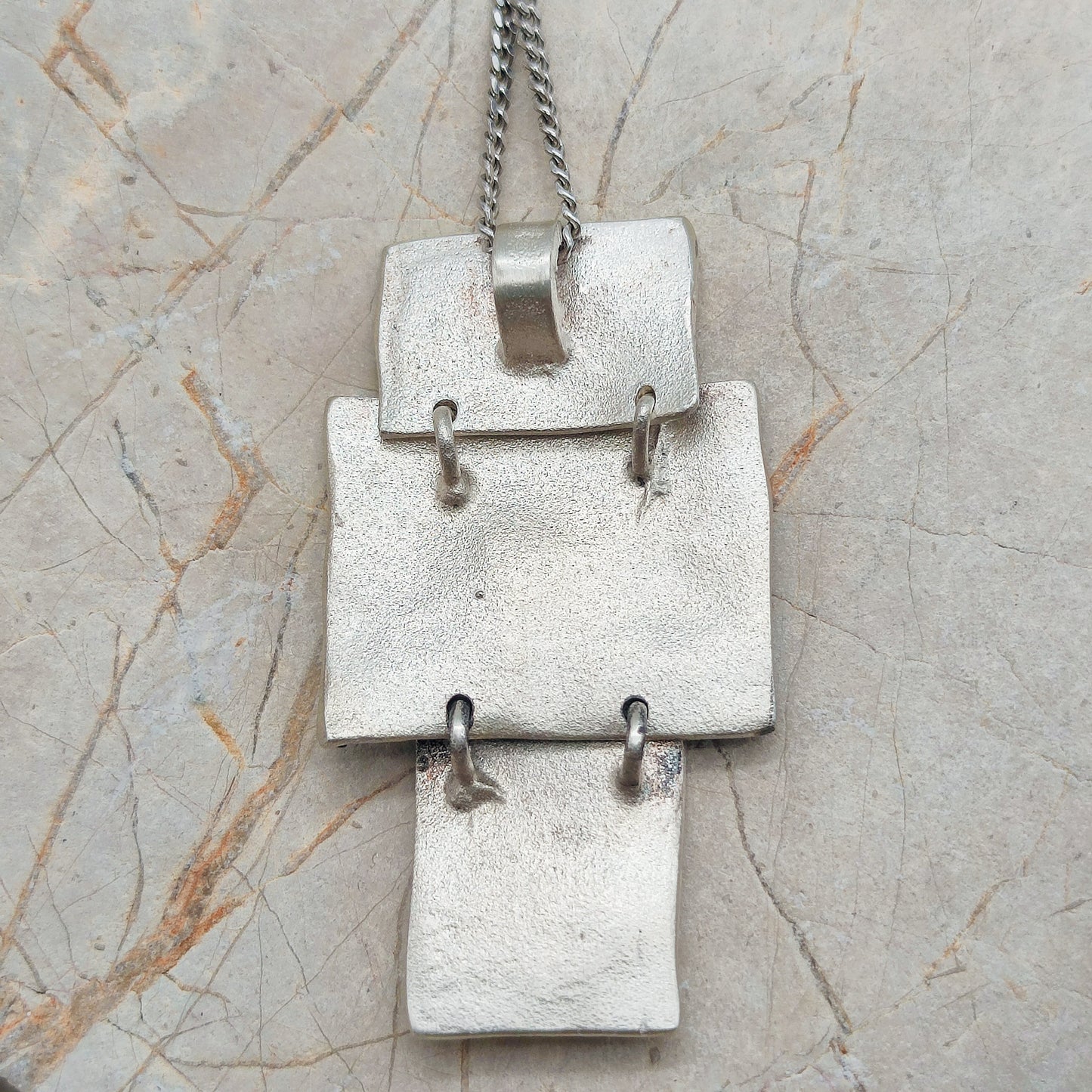 Handmade pendant by Audar in silver with 24K gold details