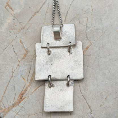 Handmade pendant by Audar in silver with 24K gold details