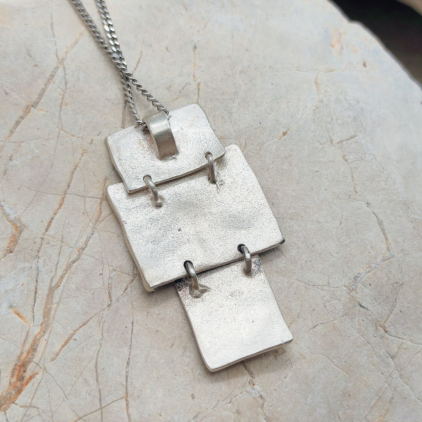 Handmade pendant by Audar in silver with 24K gold details