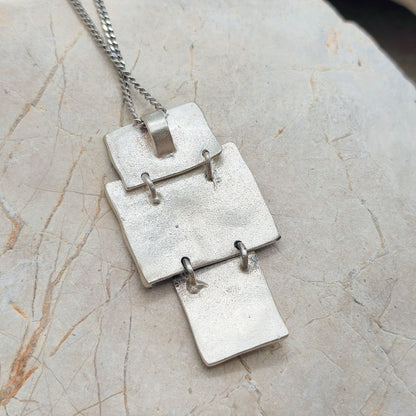 Handmade pendant by Audar in silver with 24K gold details