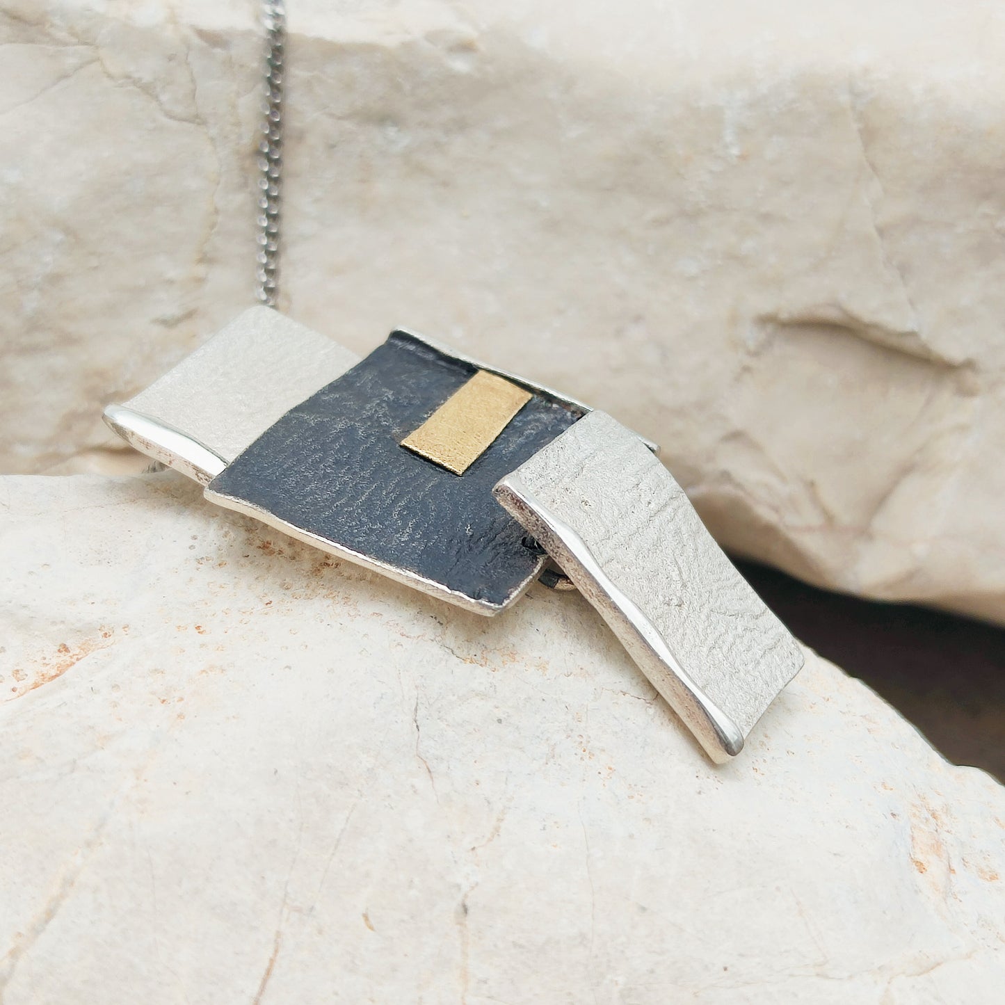 Handmade pendant by Audar in silver with 24K gold details