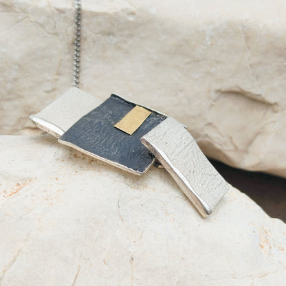 Handmade pendant by Audar in silver with 24K gold details