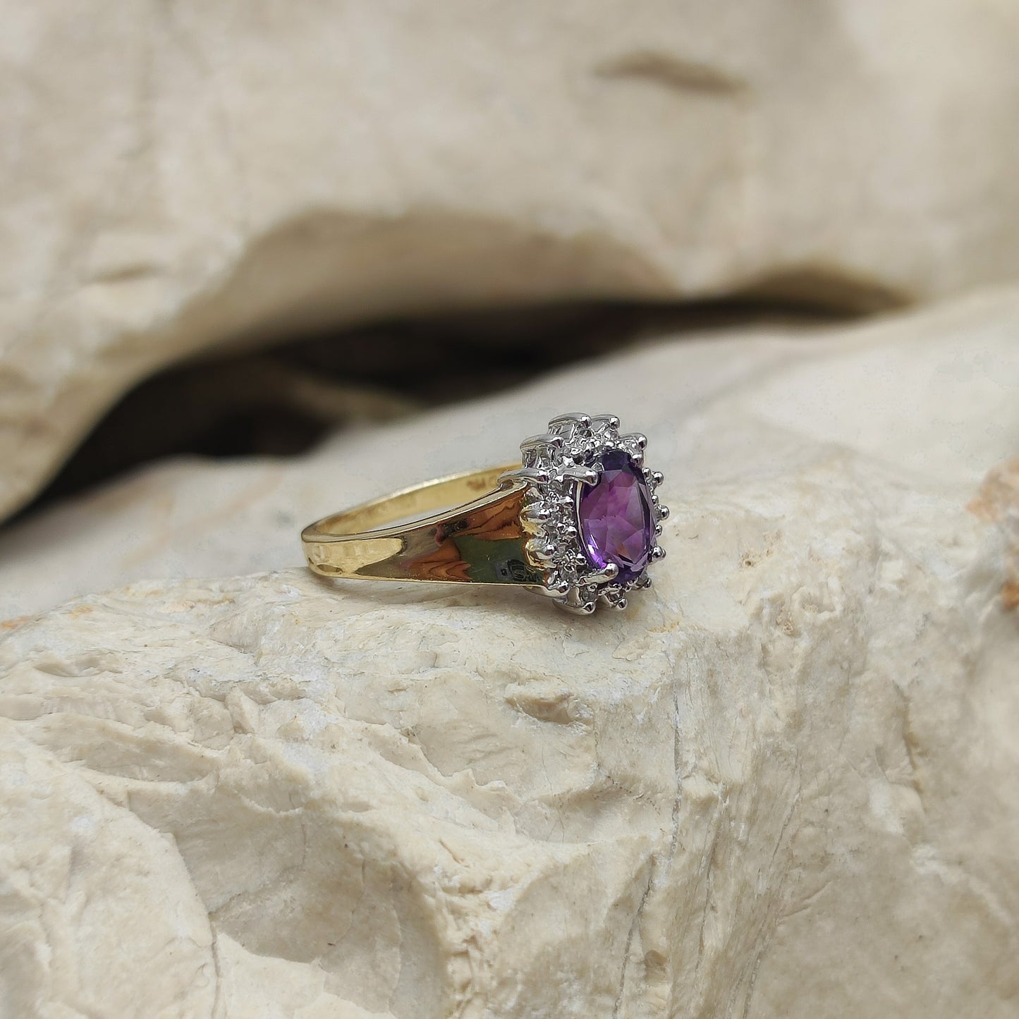 Amethyst and diamond halo ring in 9K gold