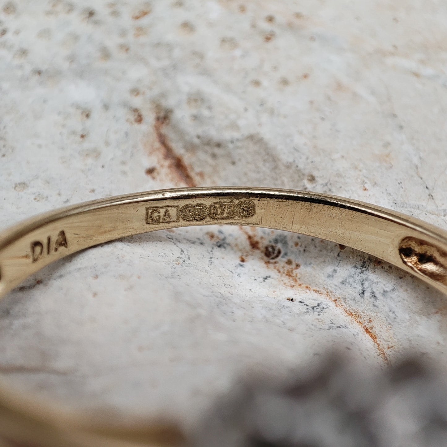 Amethyst and diamond halo ring in 9K gold