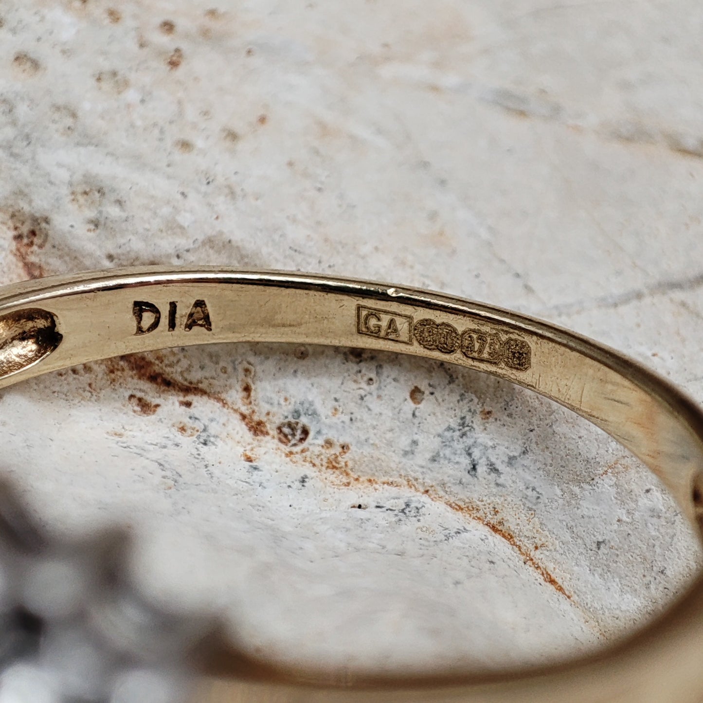 Amethyst and diamond halo ring in 9K gold