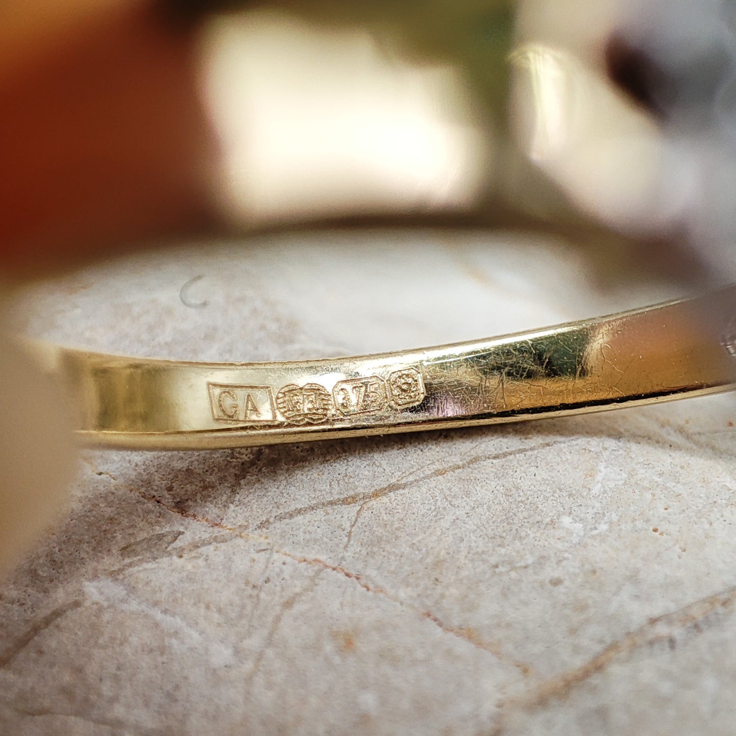 Amethyst and diamond halo ring in 9K gold