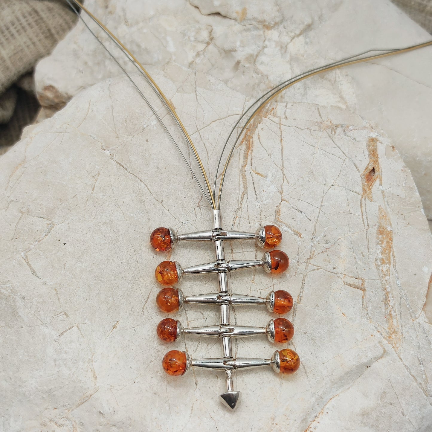 Modernist kinetic amber necklace 1970s silver