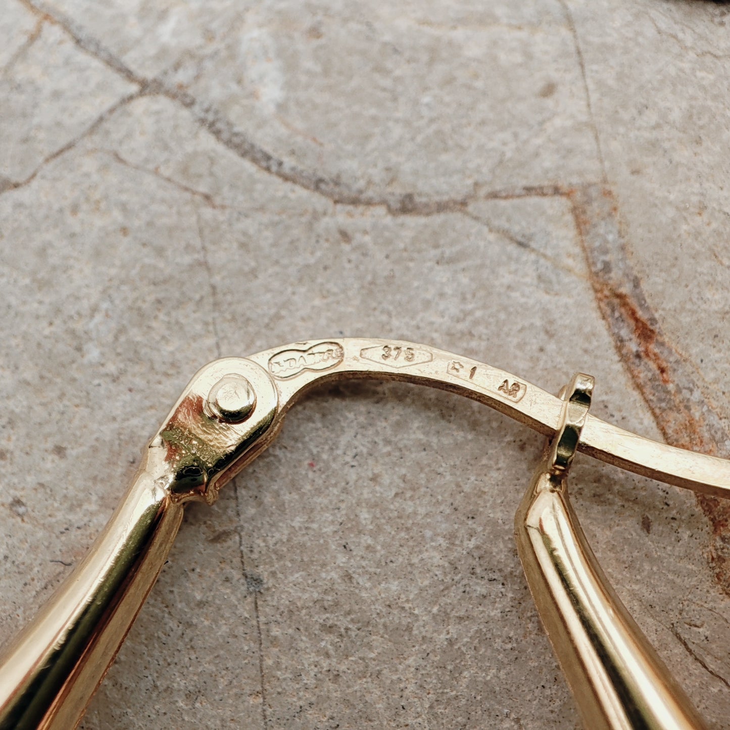 Sculptural vintage gold hoop earrings by UnoAErre imported to London
