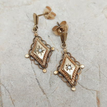 Antieke 9 karaat gouden oorbellen met stergezette diamant circa 1900