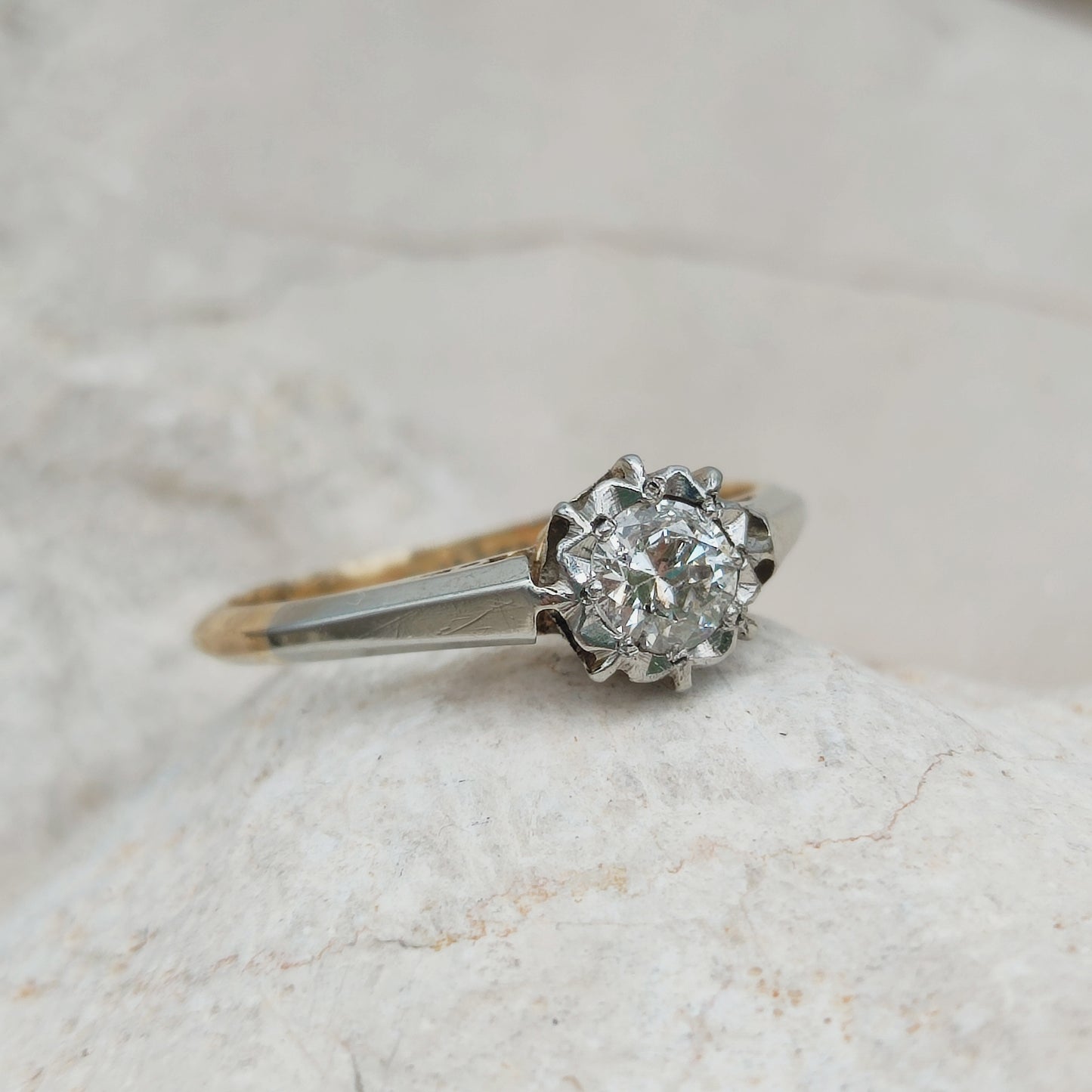 Vintage diamond solitaire ring with platinum setting close up
