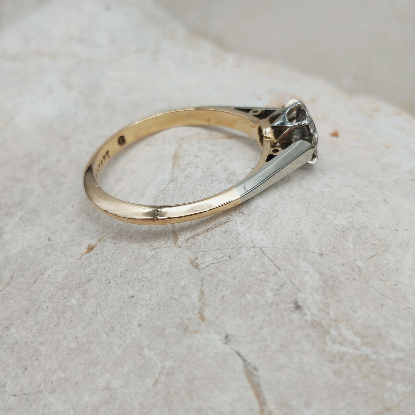 Vintage diamond solitaire ring side profile showing platinum shoulders