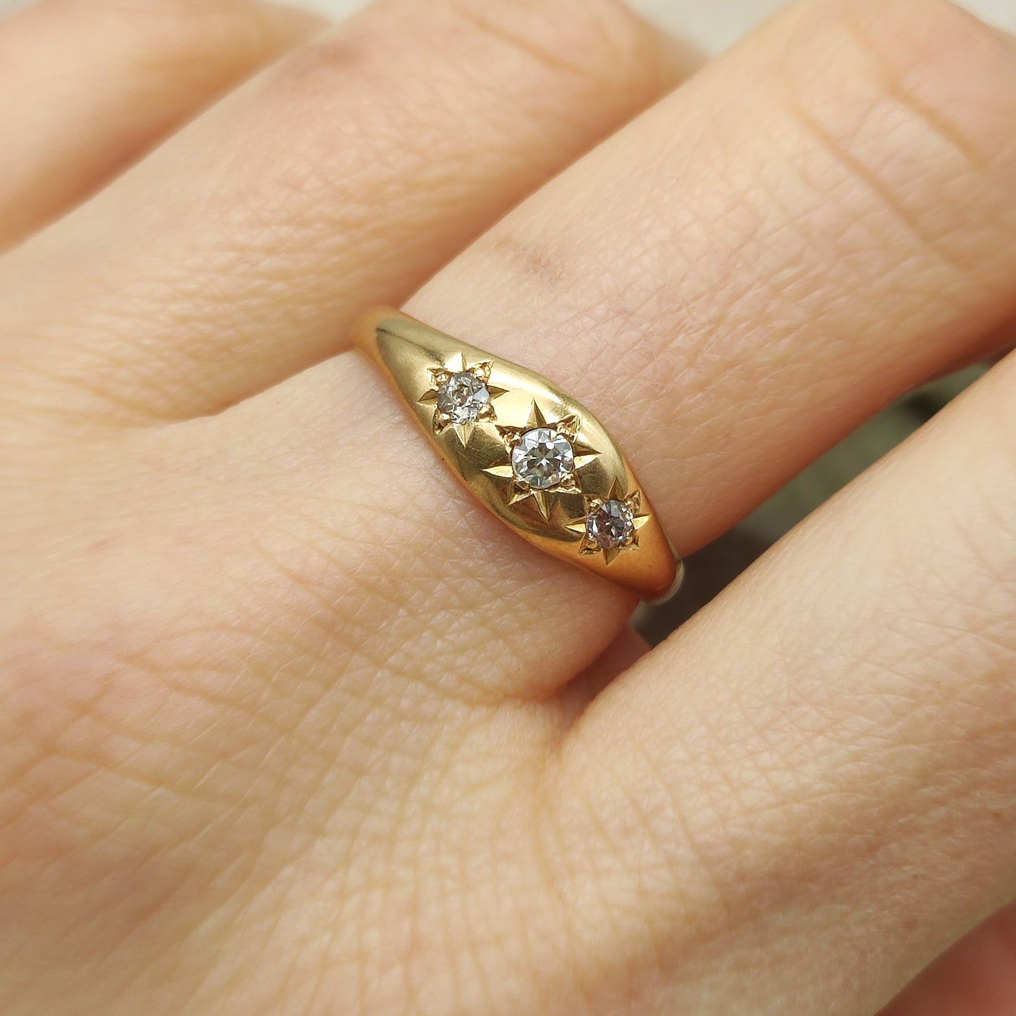 vintage gypsy diamond ring worn on finger showing star setting