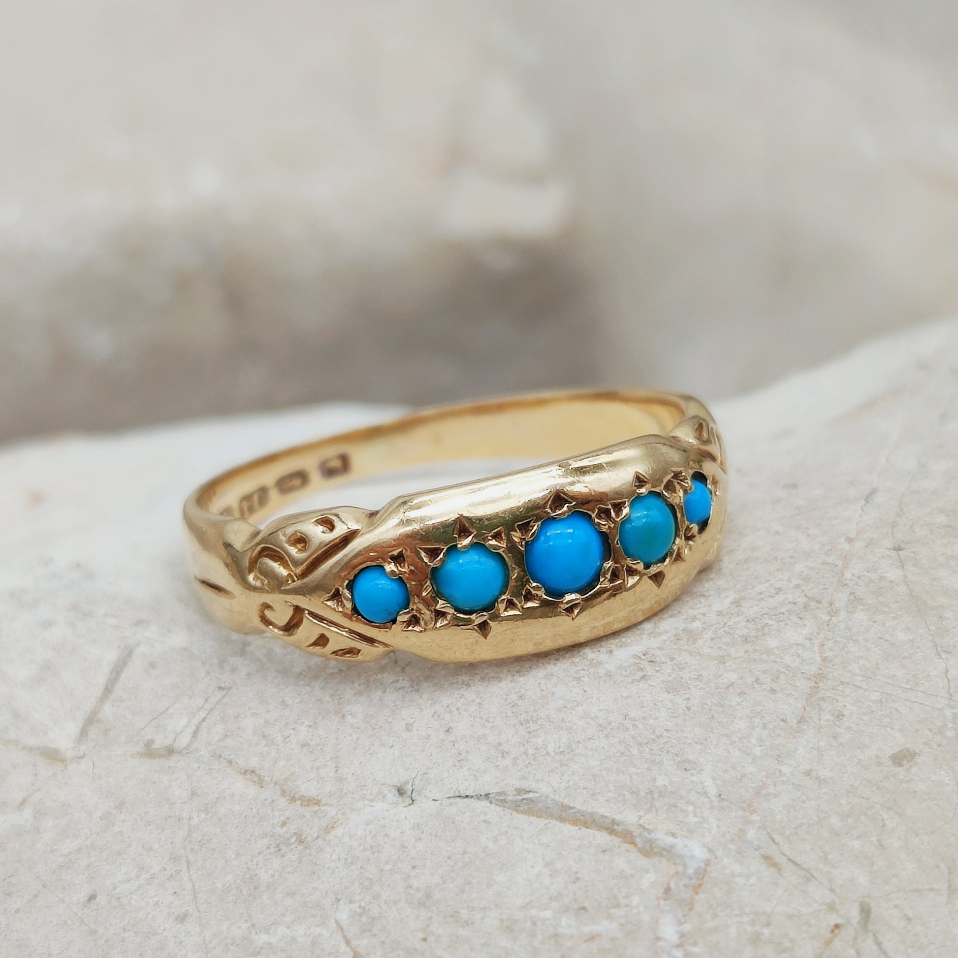 Antique turquoise cabochon ring in 18k gold angled view