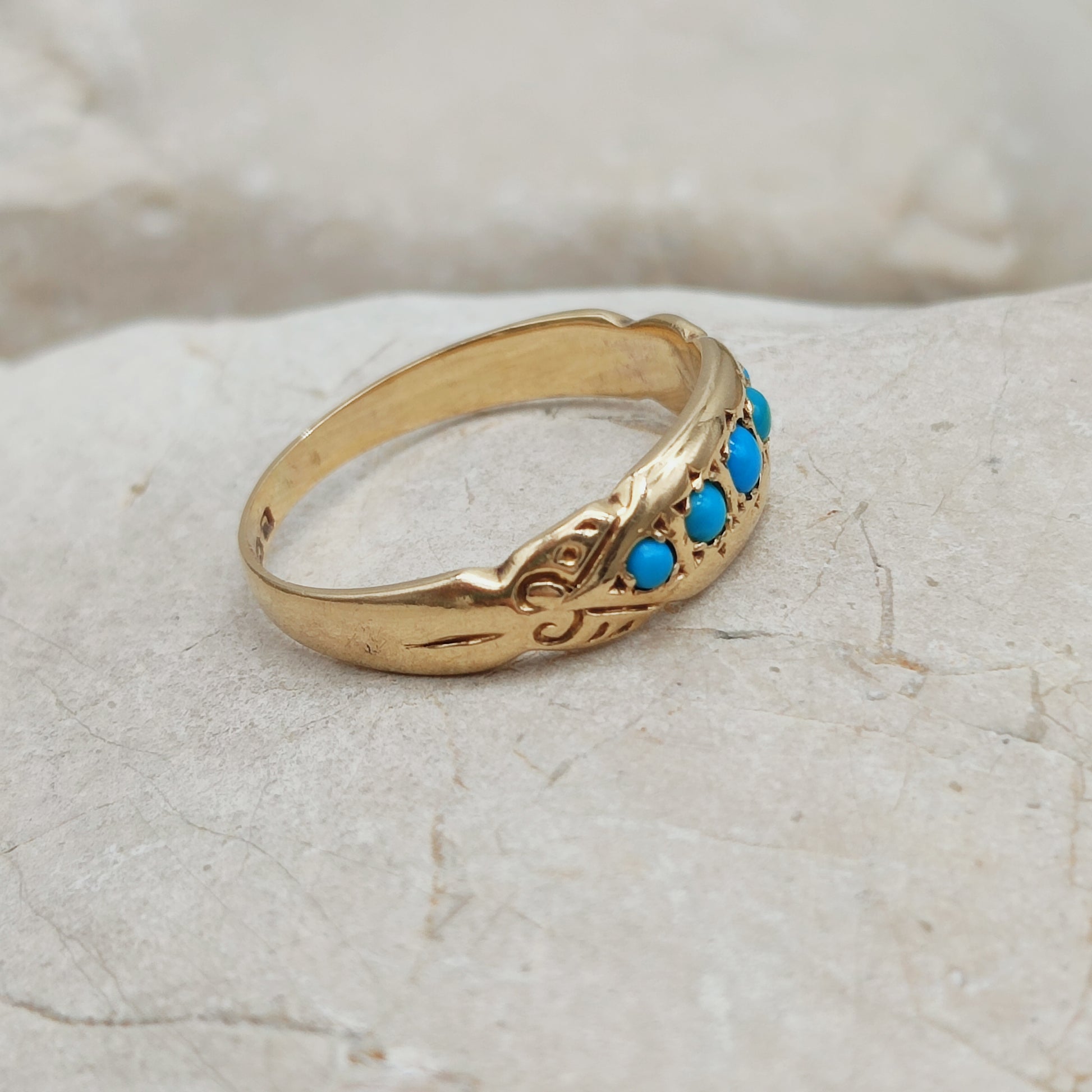 Antique turquoise ring side profile showing engraved shoulders