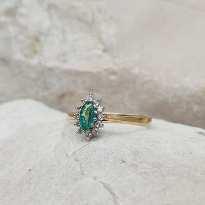 Emerald and diamond cluster ring marquise emerald close-up