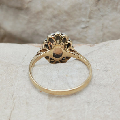 Achterzijde van vintage 18 karaat gouden ring met open zetting