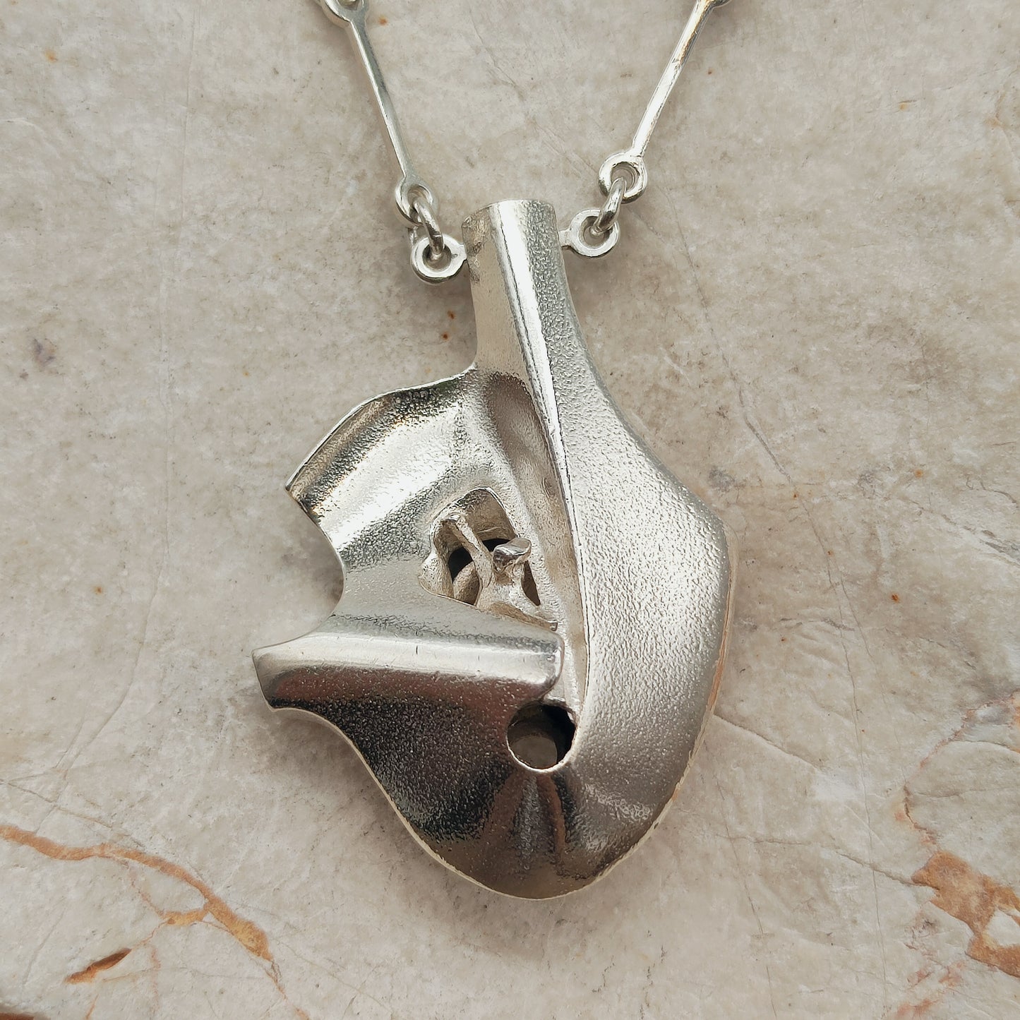 Sculptural Auriga pendant, also known as Man in the Crater