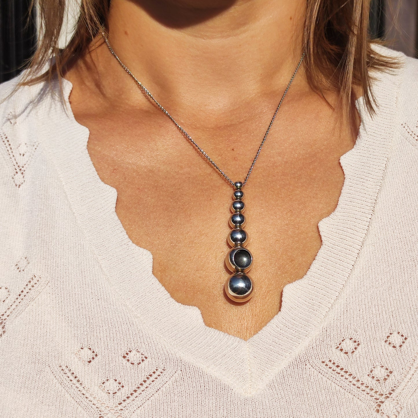 Georg Jensen Cave necklace by Jacqueline Rabun worn around the neck